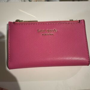 BRAND NEW SMALL SLIM BIFOLD WALLET

NEVER USED